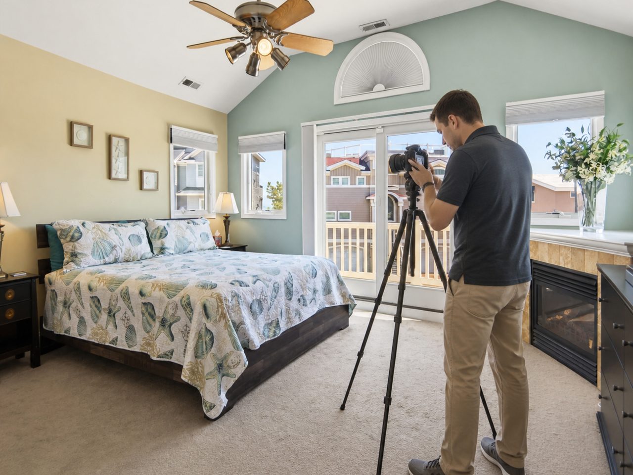Professional photographer shooting the main bedroom of a Long Beach Island vacation rental